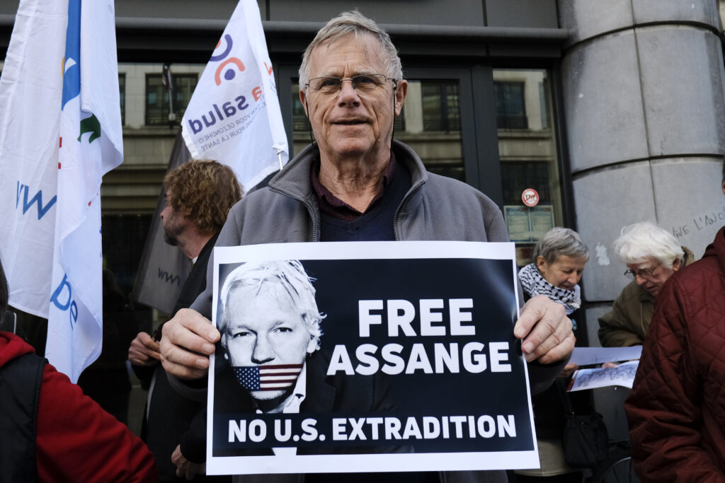 Brussels, Belgium. 15th April 2019.Supporters of WikiLeaks founder Julian Assange rally outside of British Embassy.